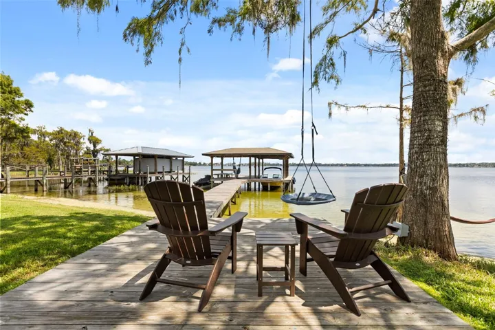 A private dock and boatlift provide immediate access to Lake Sheen and the entire Butler Chain, while a gated community boat ramp is approximately 300 feet away.