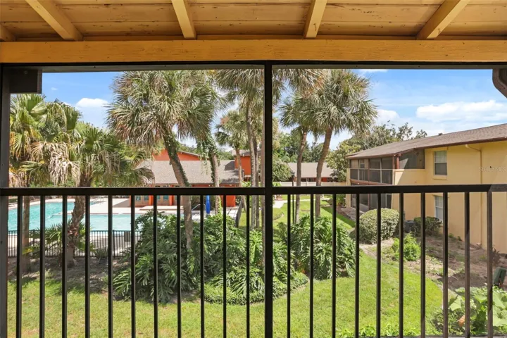 Screened back patio w/ pool view