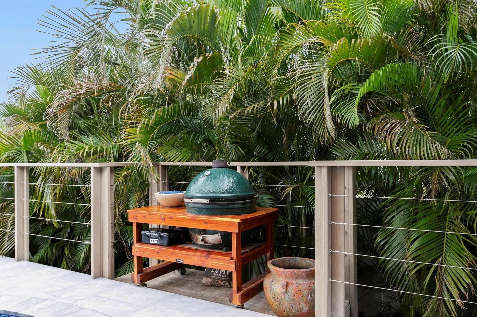 Pop-out grill station and mature vegetation for added privacy