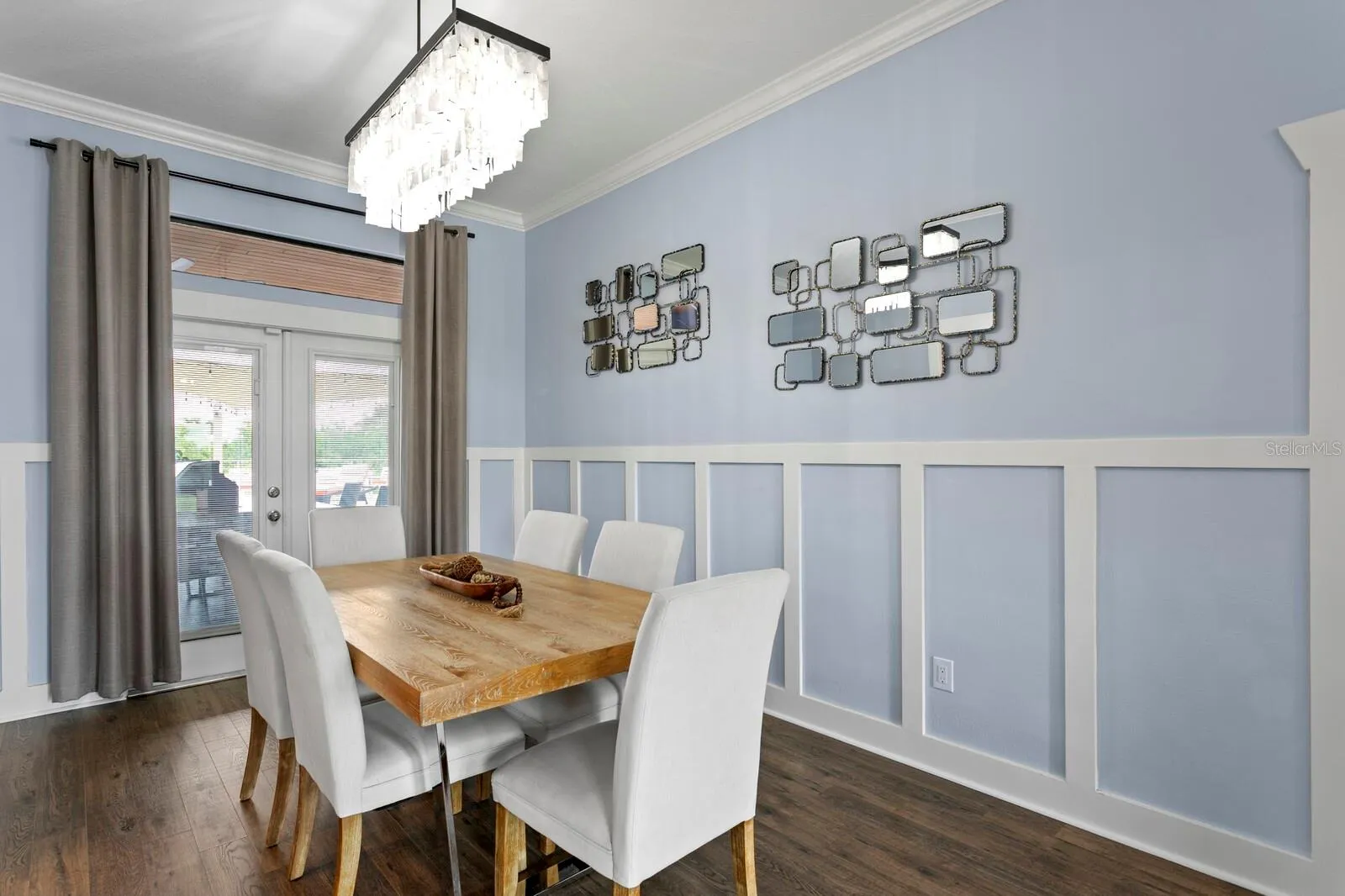 Formal Dining Room with french doors opening to covered rear patio
