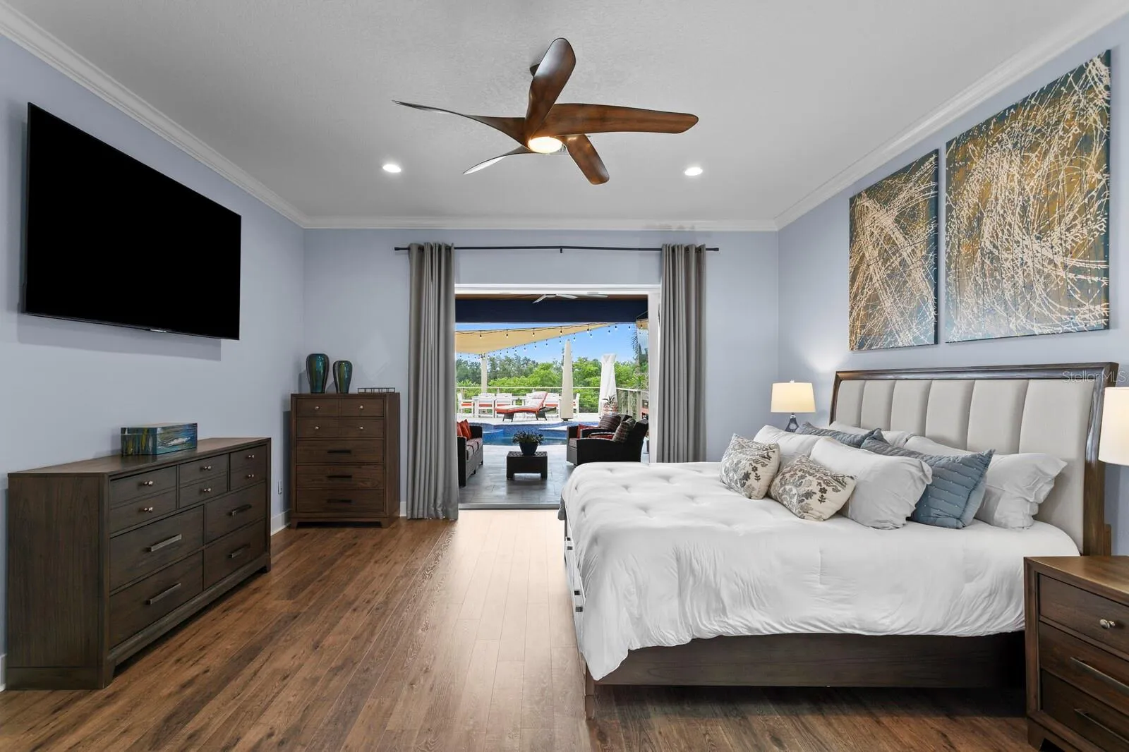 Enjoy backyard oasis views from your new Primary Bedroom
