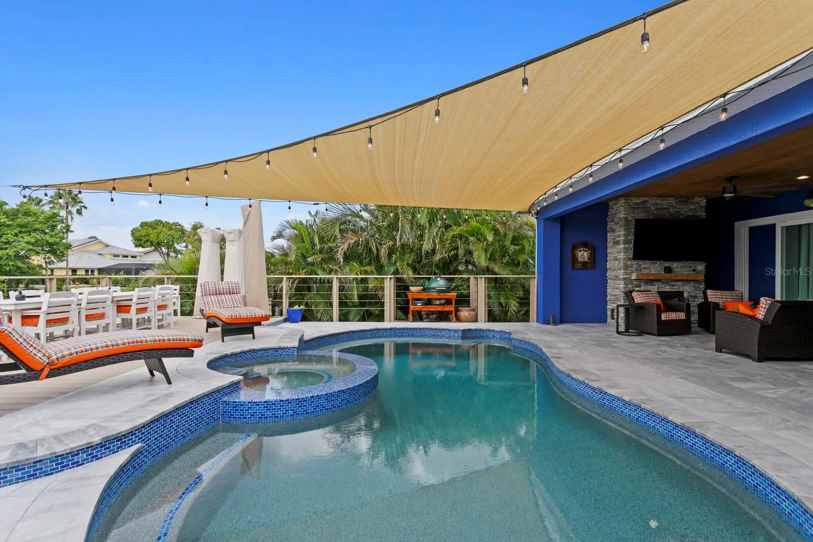 Redesigned pool with pebble tec and heated/polar plunge spa with infinity edge