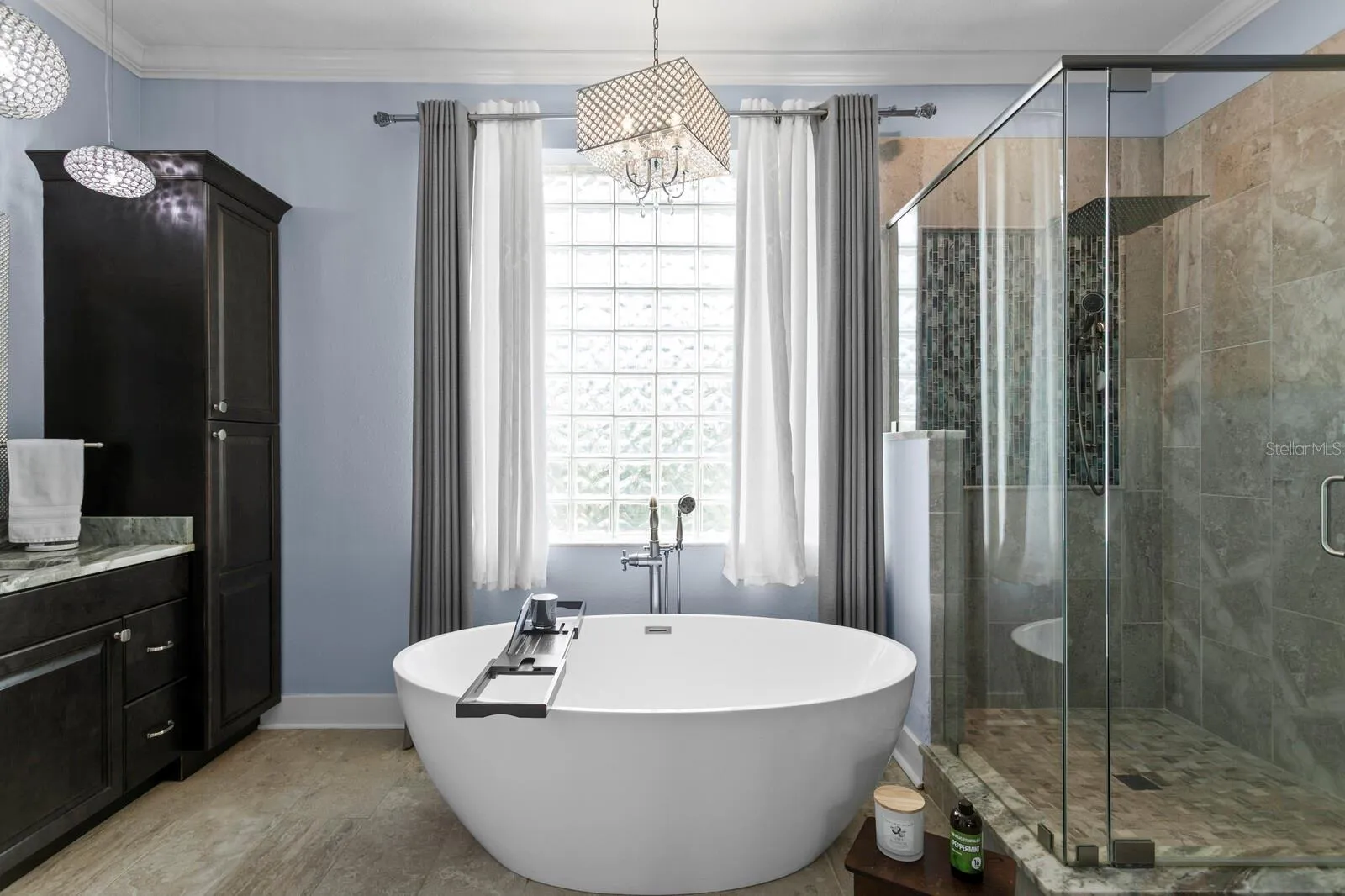 Ensuite bath features garden tub, frameless walk-in shower with dua shower heads
