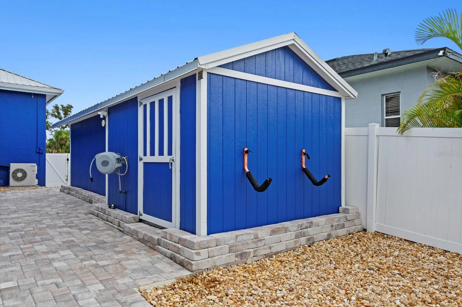 Large storage shed is attached to workshop which includes electricity and air conditioning