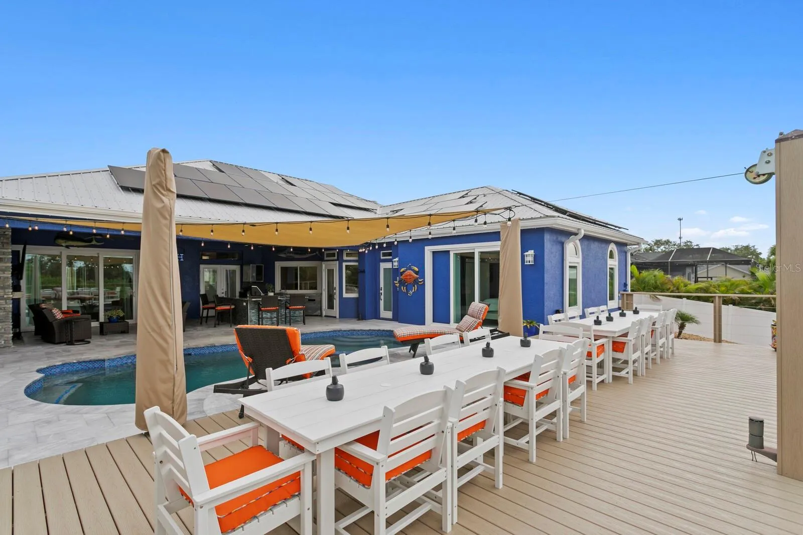Deck features two large shade umbrellas bolted into deck