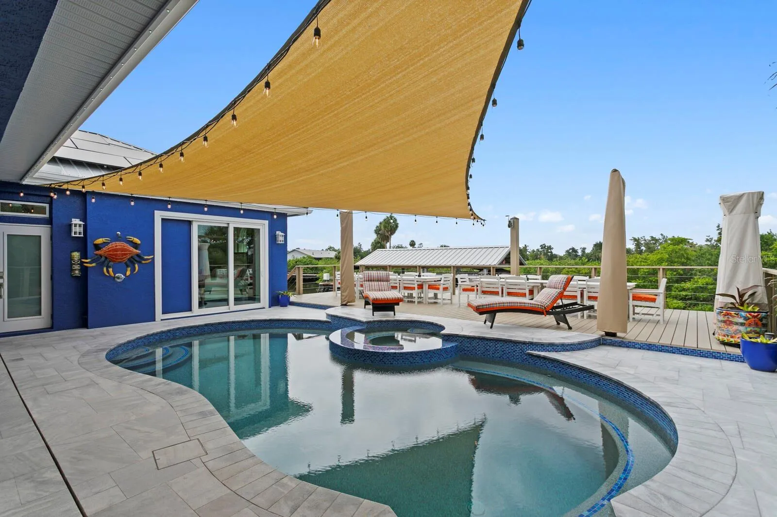 Redesigned pool features a wrap-around bench