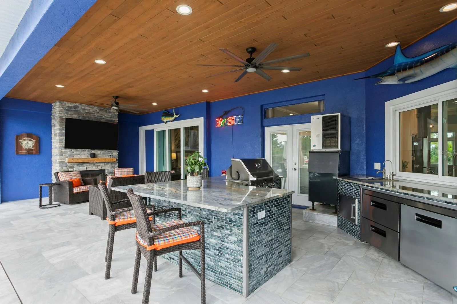 Covered Patio with tongue and groove ceiling and ceiling fans