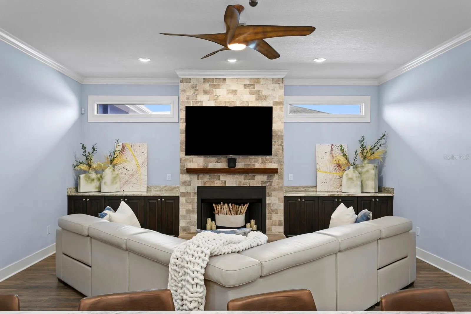 Family Room features dual transom lights, wood burning fireplace, and granite counters