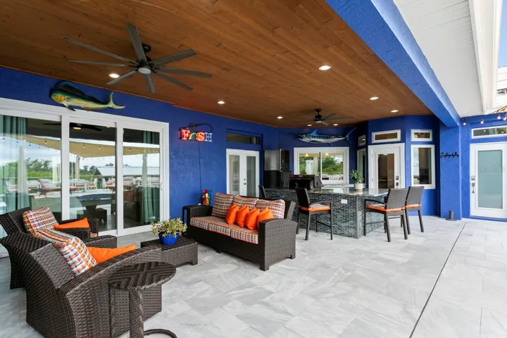 Covered Patio and Pool Deck feature sanded marble tile flooring