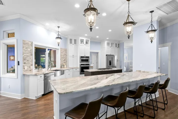 Large Kitchen island with Granite counters with breakfast bar seating