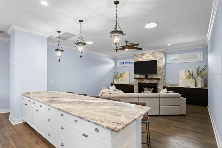 Ample Kitchen storage with large island opens to Family Room