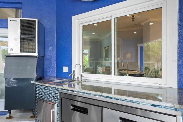 Large pass-through window from the indoor Kitchen to the outdoor Kitchen
