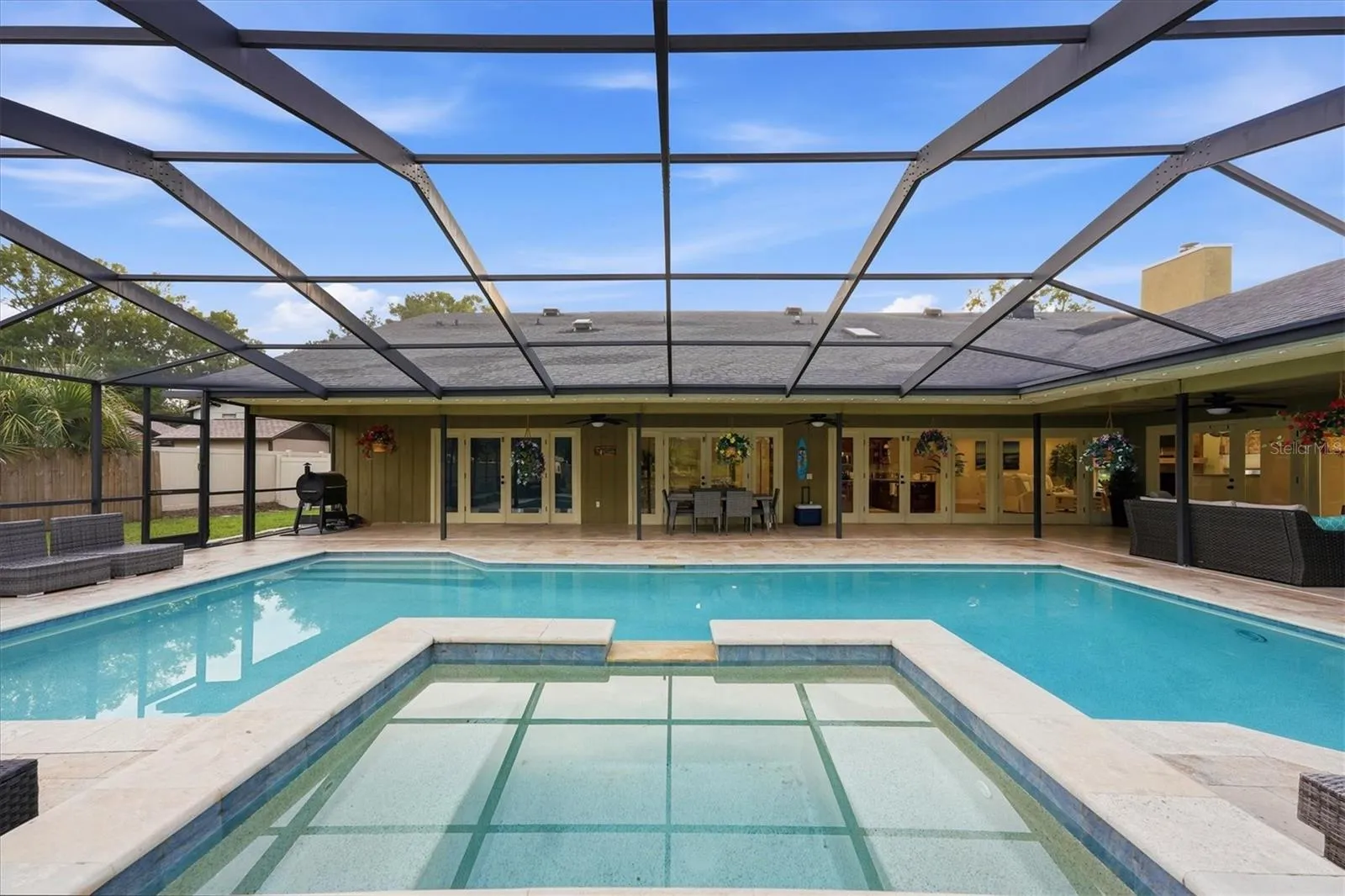 View from spa overlooking pool and patio