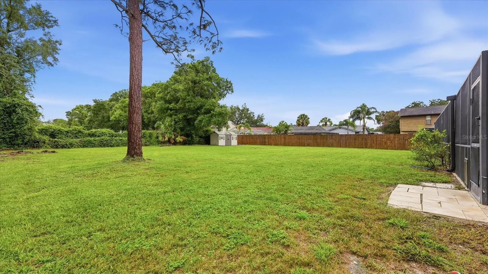 Your furbabies will love this backyard.  Storage shed provides a space for lawn equipment, yard toys &amp; games, etc.
