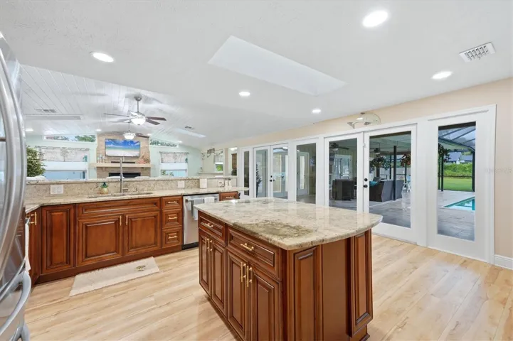 Large center island offers more storage including a cabinet with pull out racks for pots and pans