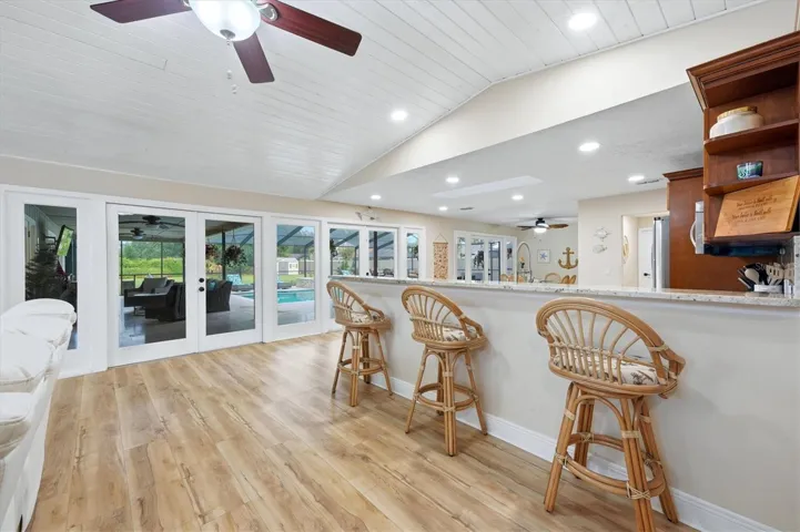Spacious breakfast bar has great view out to the patio &amp; pool area + space for additional seating if desired.