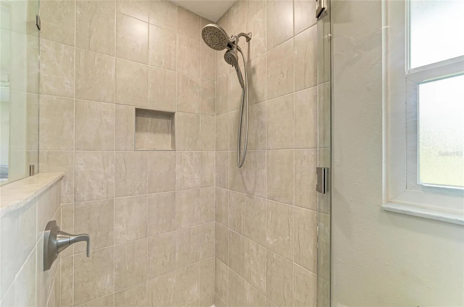Ensuite bath with walk-in shower, granite counters and walk-in closet.