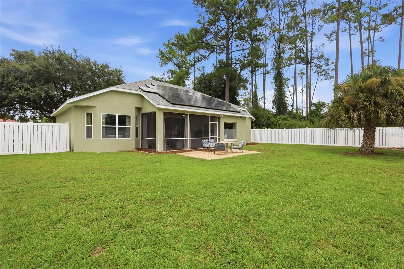 Spacious vinyl fenced backyard. Solar panels provide electric bills of around $60/mo.