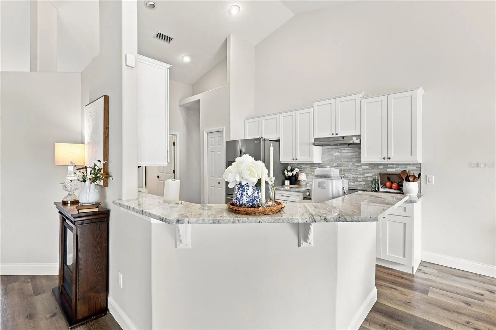 Breakfast bar with granite countertops. Kitchen remodel in 2026.