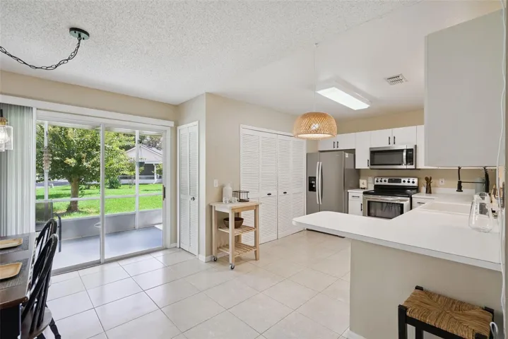 Plenty of natural light overlooking screened patio