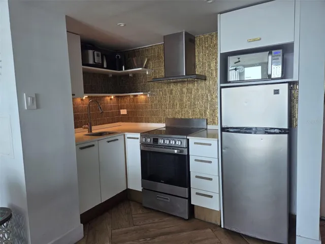 Kitchen has stove and full size oven.