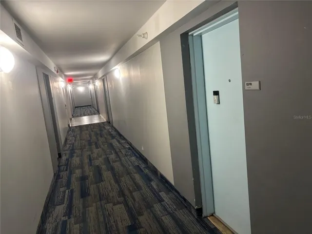 Hallway with access to both elevator banks.
