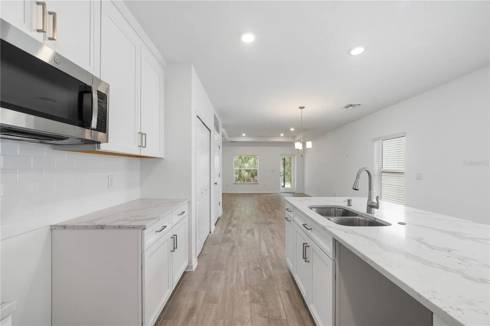 Kitchen with island sink and eat at counter