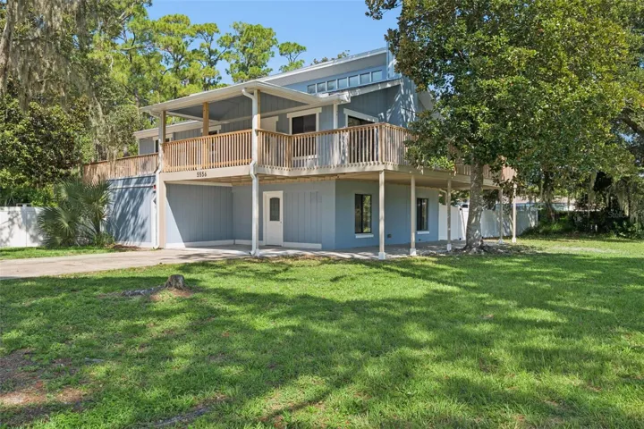 Welcome home to this one of a kind Florida cottage home with 2268 square feet and  located on a corner lot featuring two combined parcels totaling 0.59 acres along
