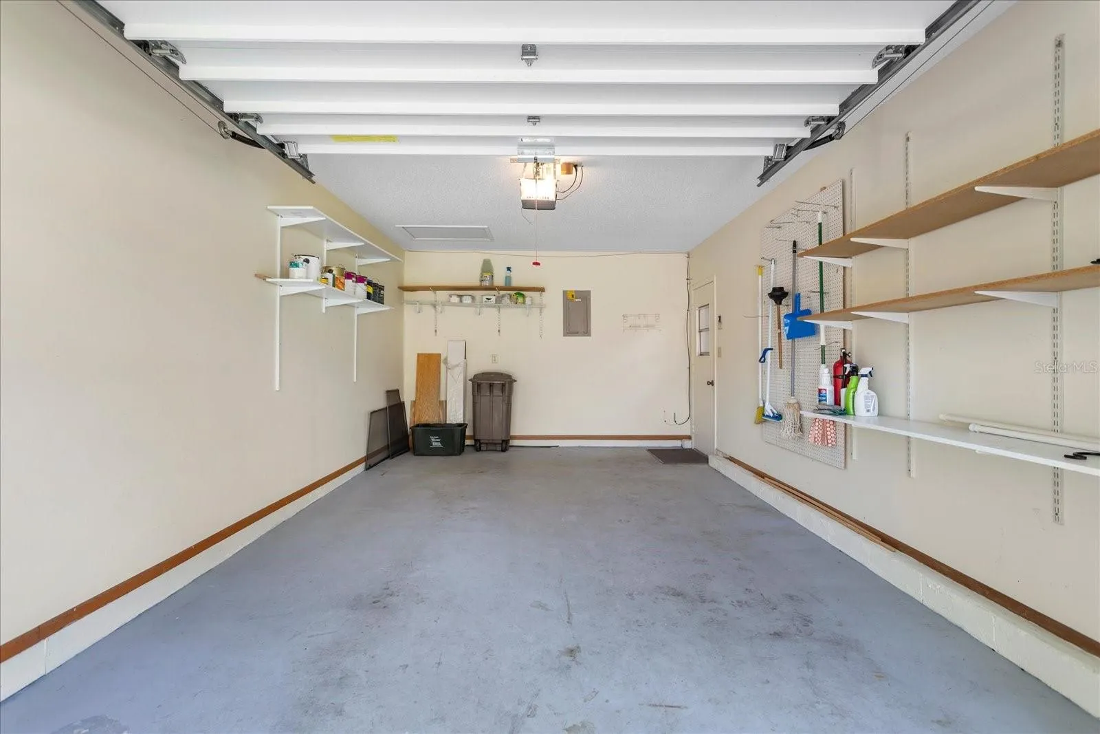 With shelving and pegboard for all your storage