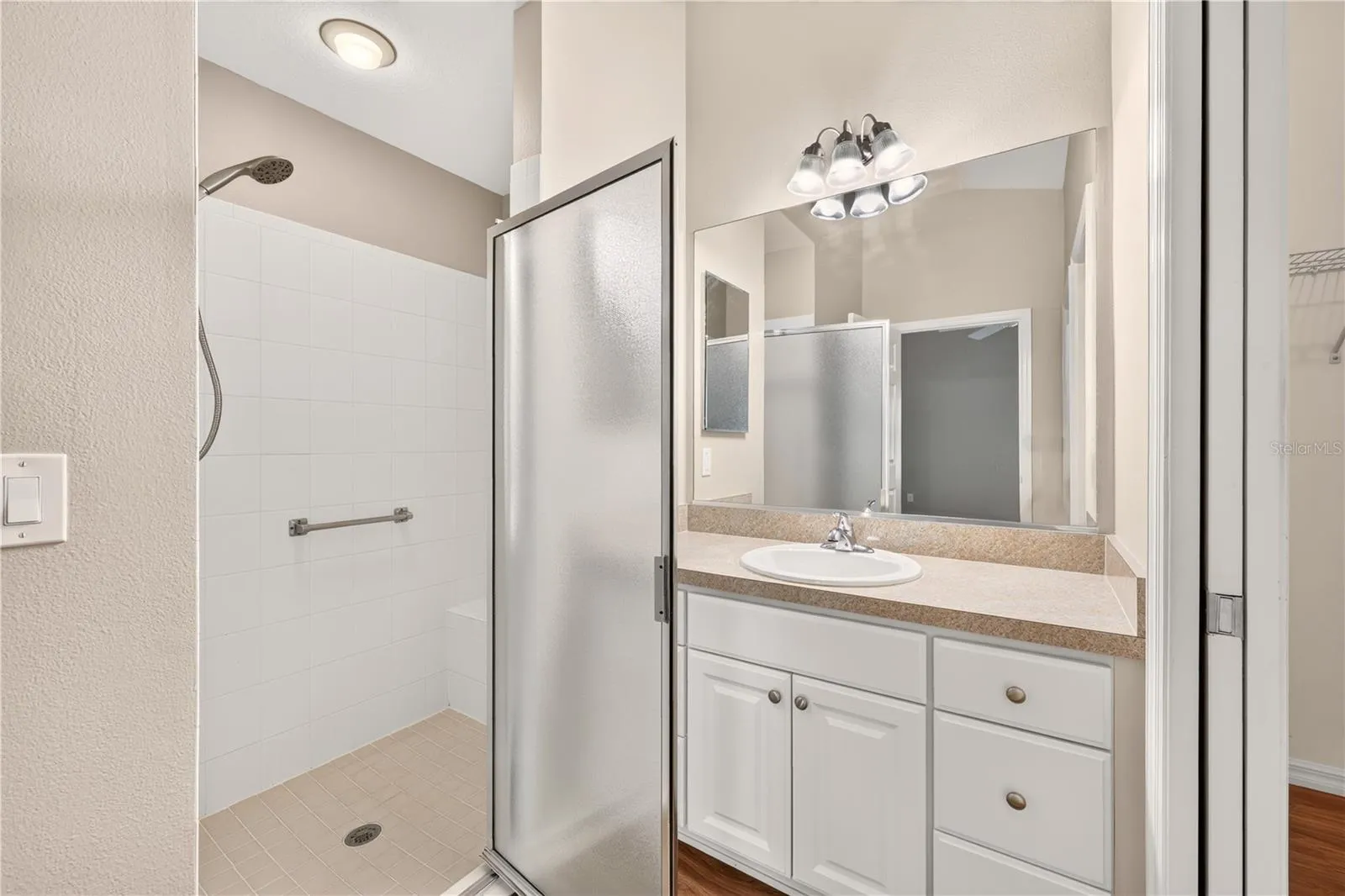 WALK IN TILED SHOWER WITH BENCH