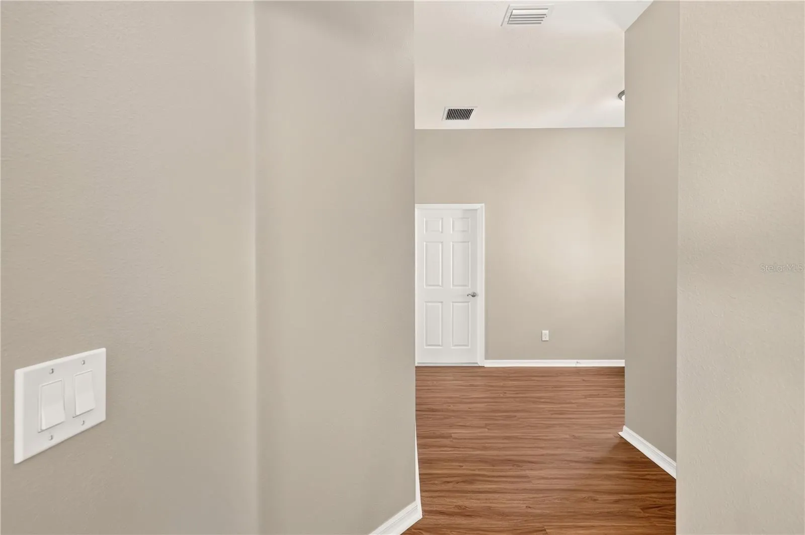 CORRIDOR FROM FRONT ENTRANCE TO OPEN LIVING AREA