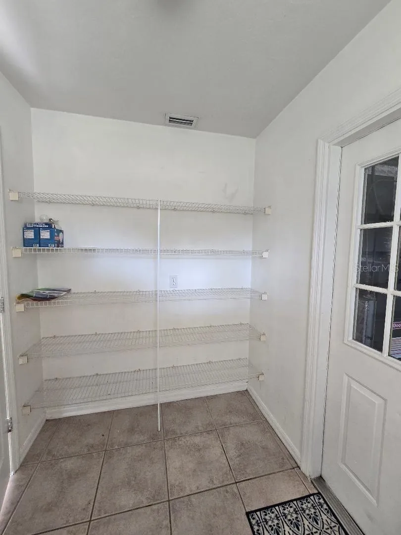 Laundry room pantry style shelving