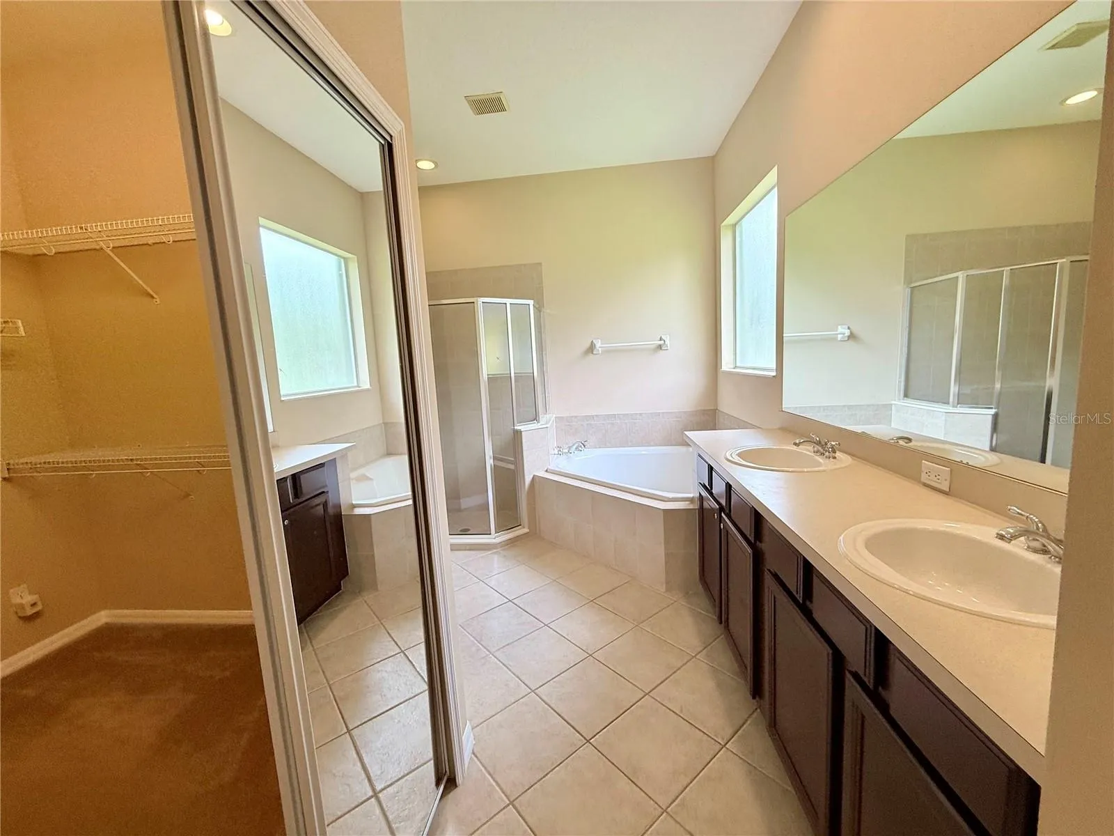 Master bathroom with large walk in closet