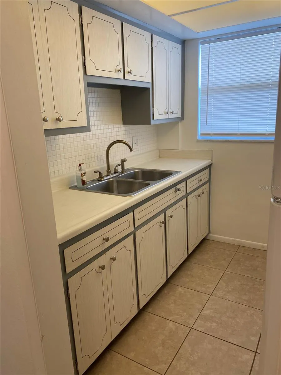 Kitchen. Window looks out over the walkway & parking area.