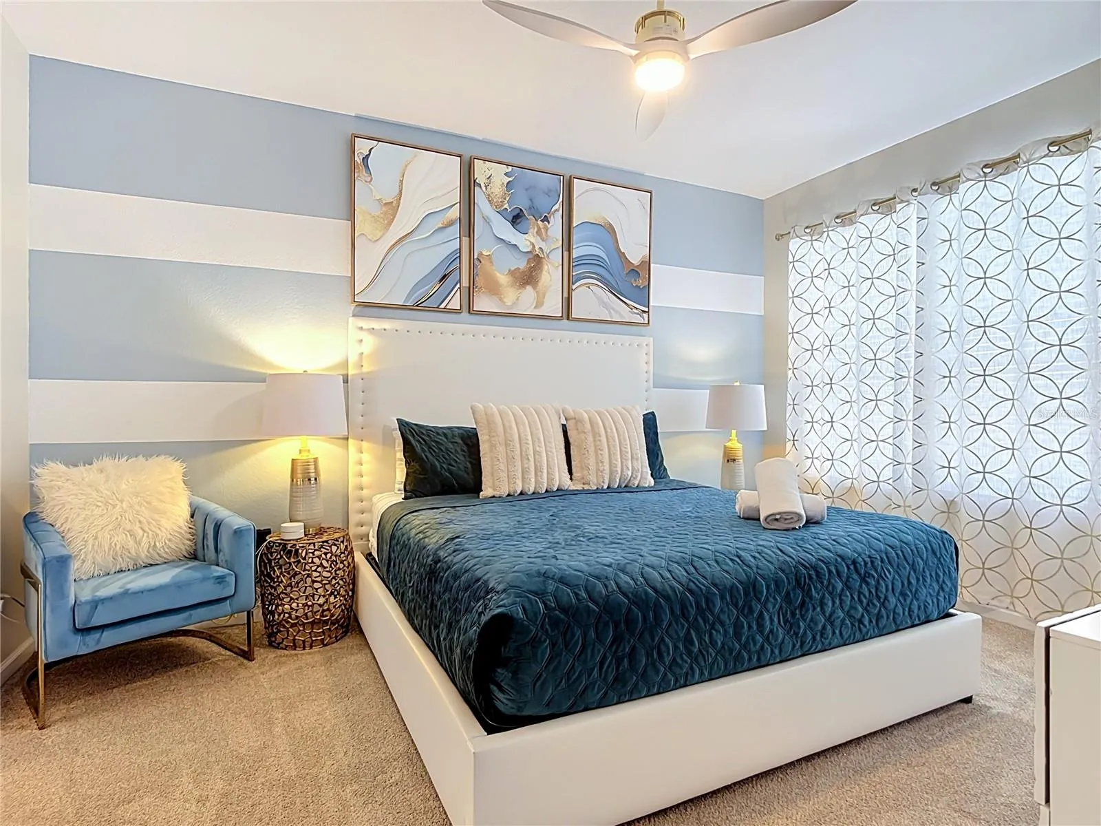 Second first-floor primary suite with king bed and private ensuite bathroom.