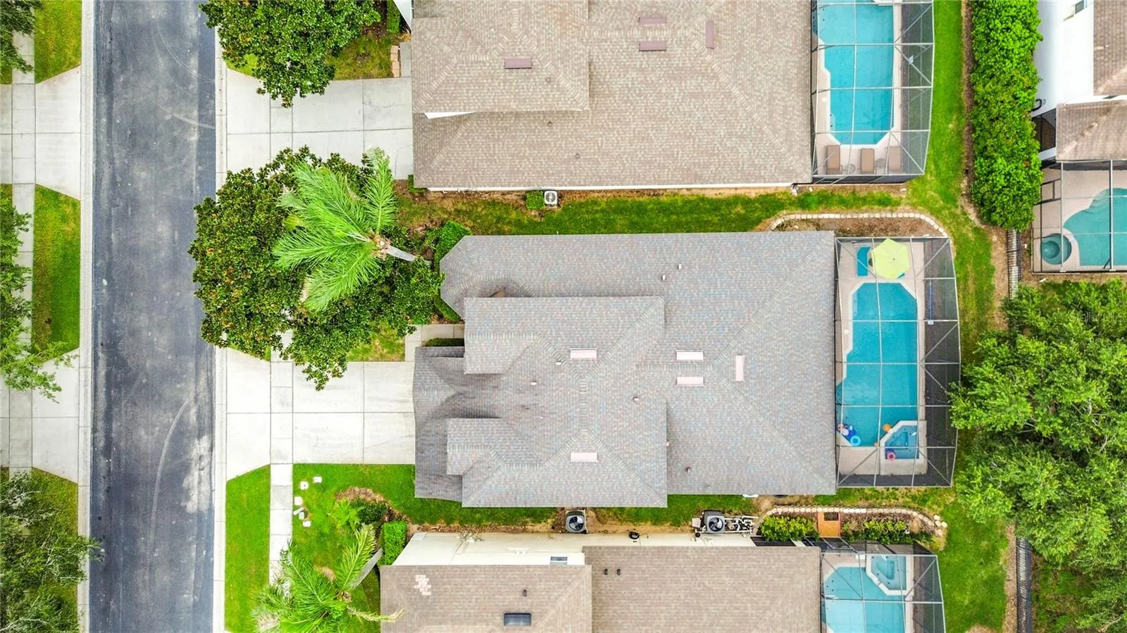 Aerial view showcasing the home's private pool enclosure.