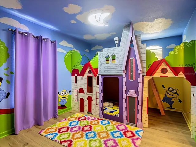 Custom Minions-themed bedroom with colorful décor and bunk beds.