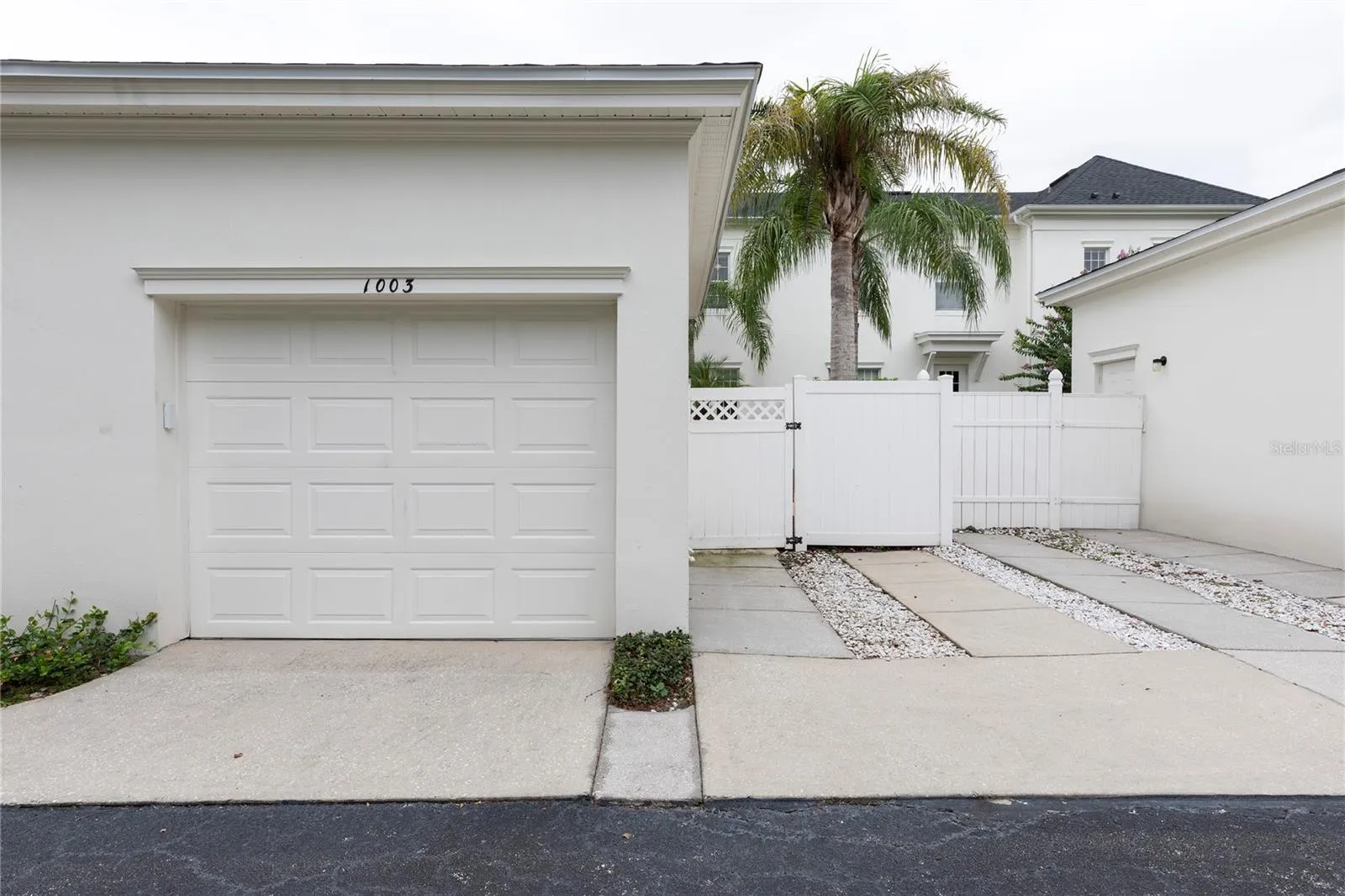 Detached 1 car garage with dedicated parking pad.