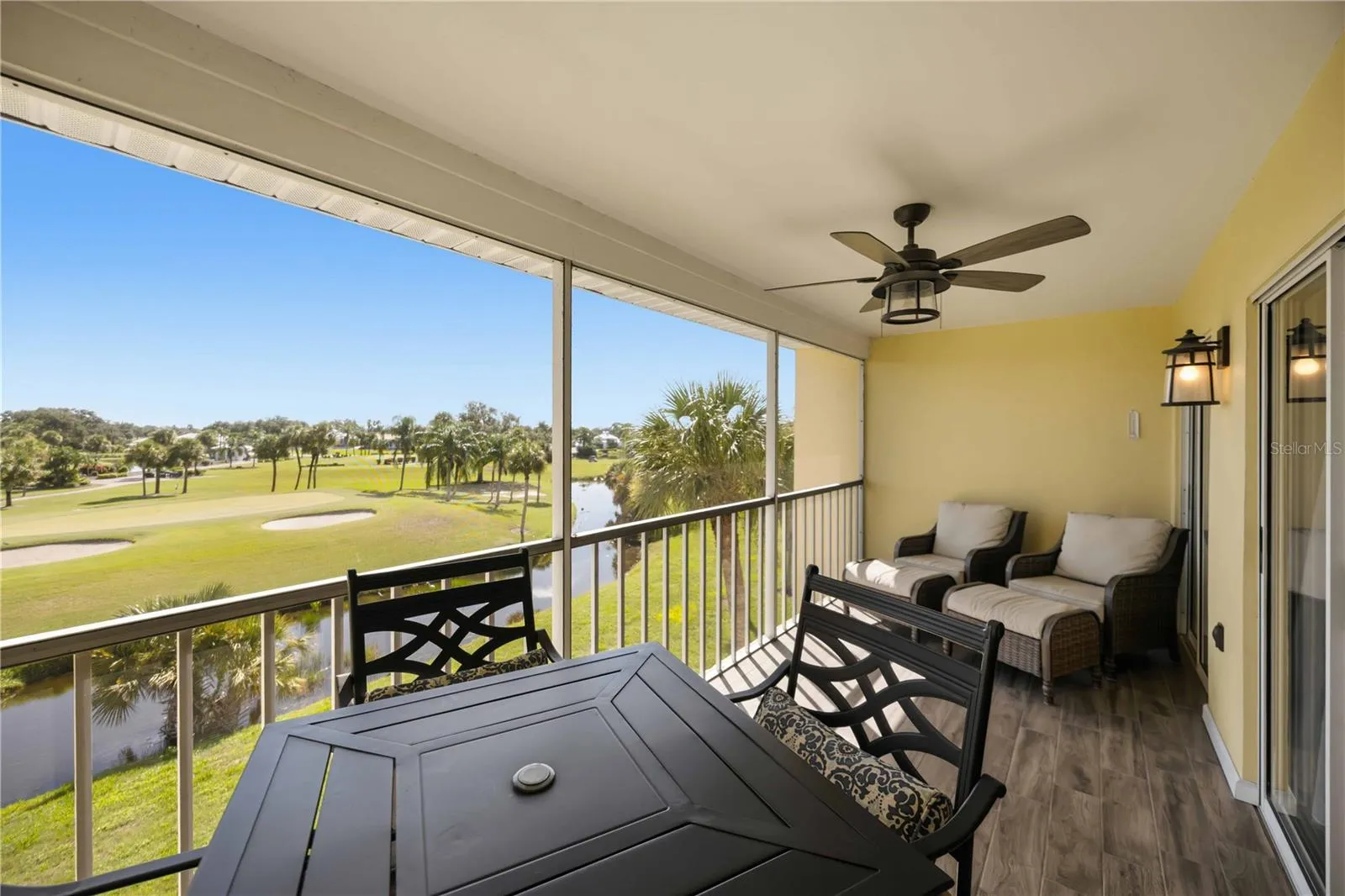 Covered and screened outdoor living makes it easy to enjoy the beautiful water and golf views throughout the day.