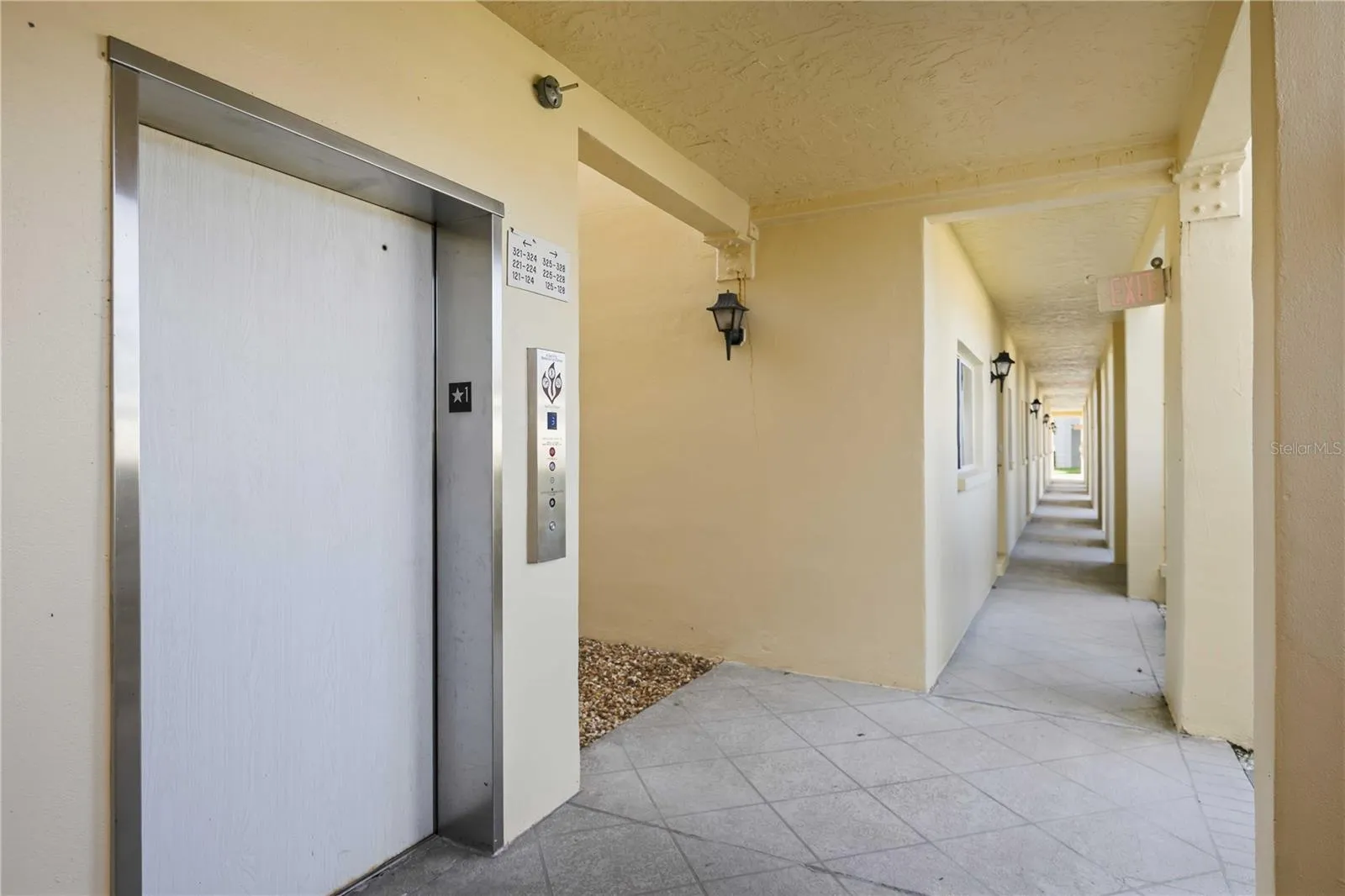 Convenient elevator access just steps from the residence along a covered walkway.