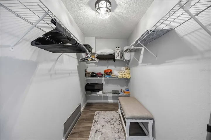 Primary bedroom walk-in closet