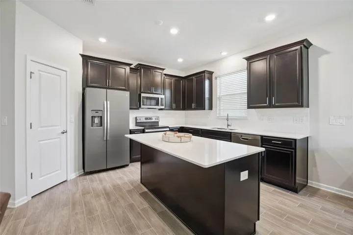 View of Kitchen with Ample Lighting