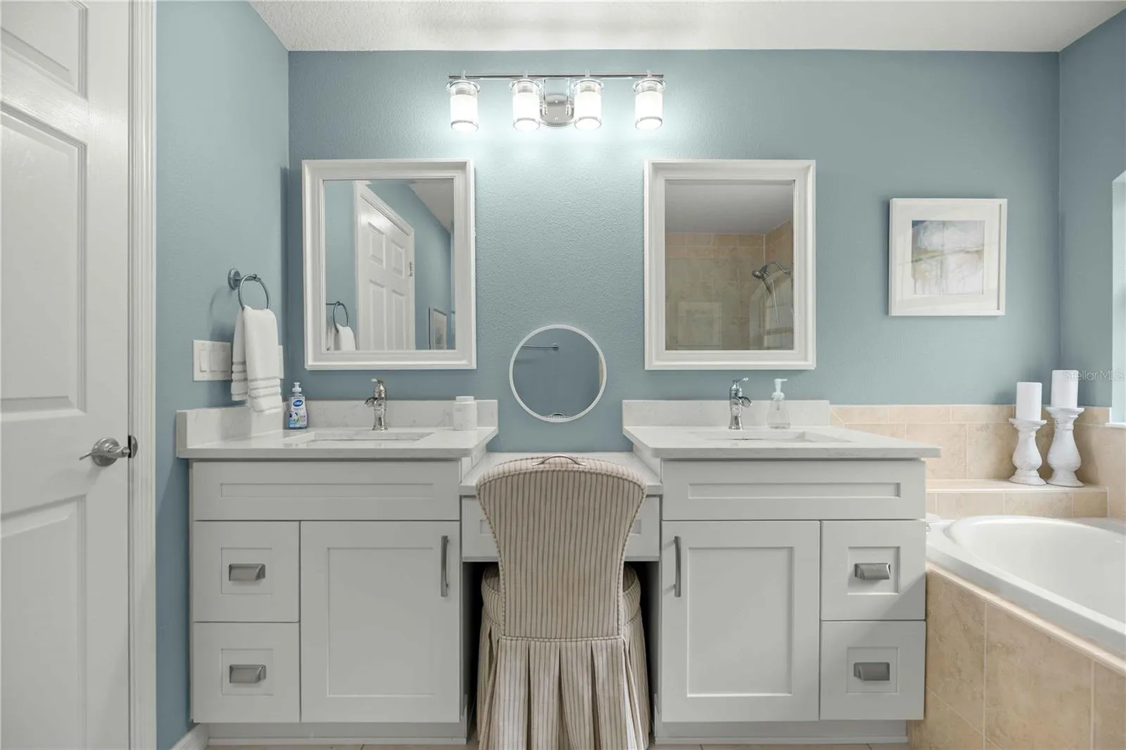 Primary bathroom two sinks and vanity