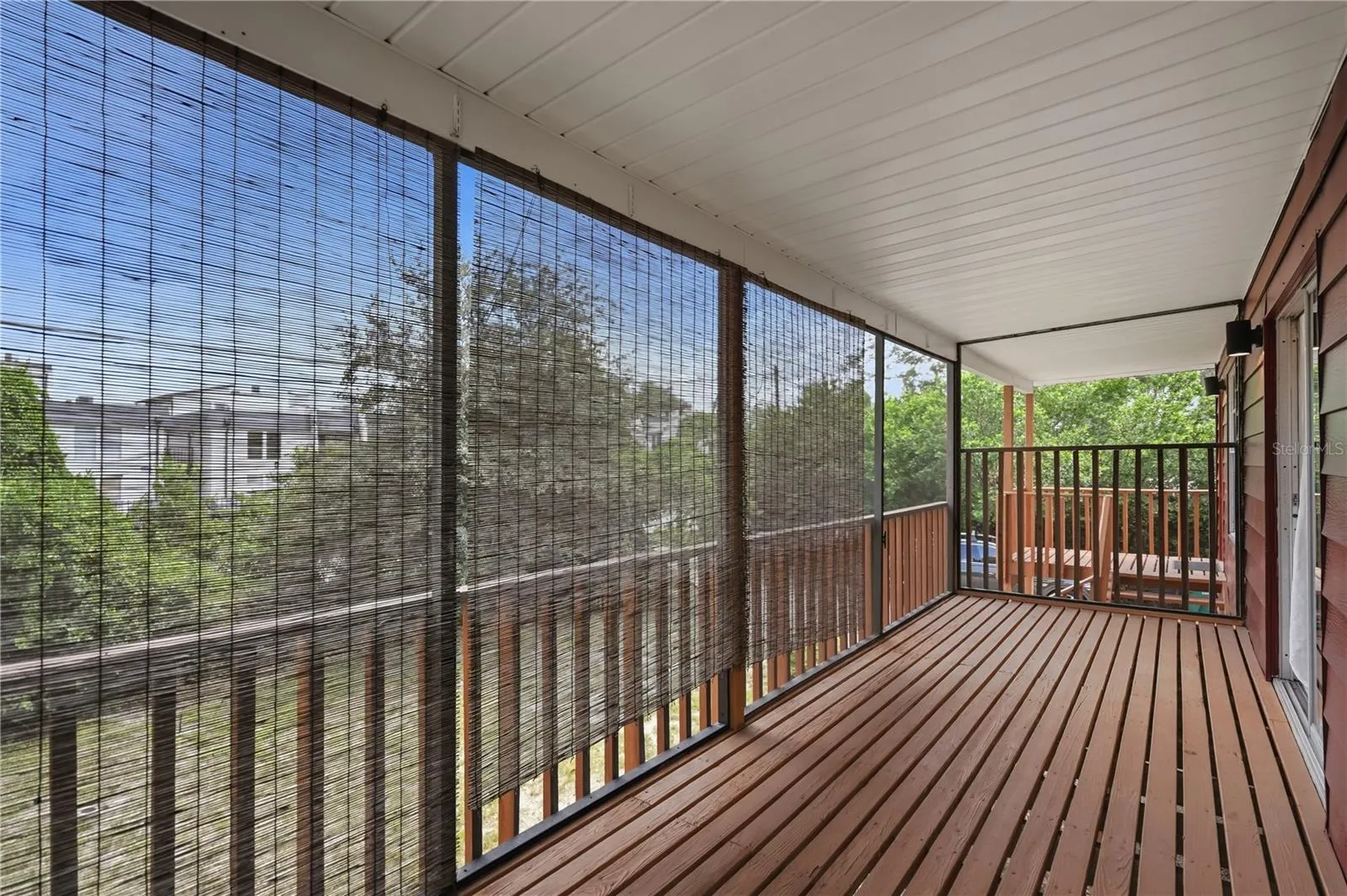SCREENED IN PORCH UPSTAIRS OFF LIVING AREA