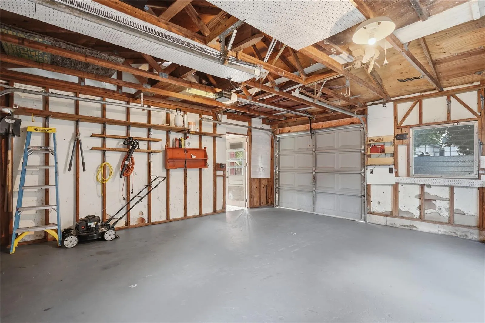OVERSIZED ONE CAR GARAGE WITH 2 GARAGE DOORS.  ROOM FOR A LARGE WORSHOP