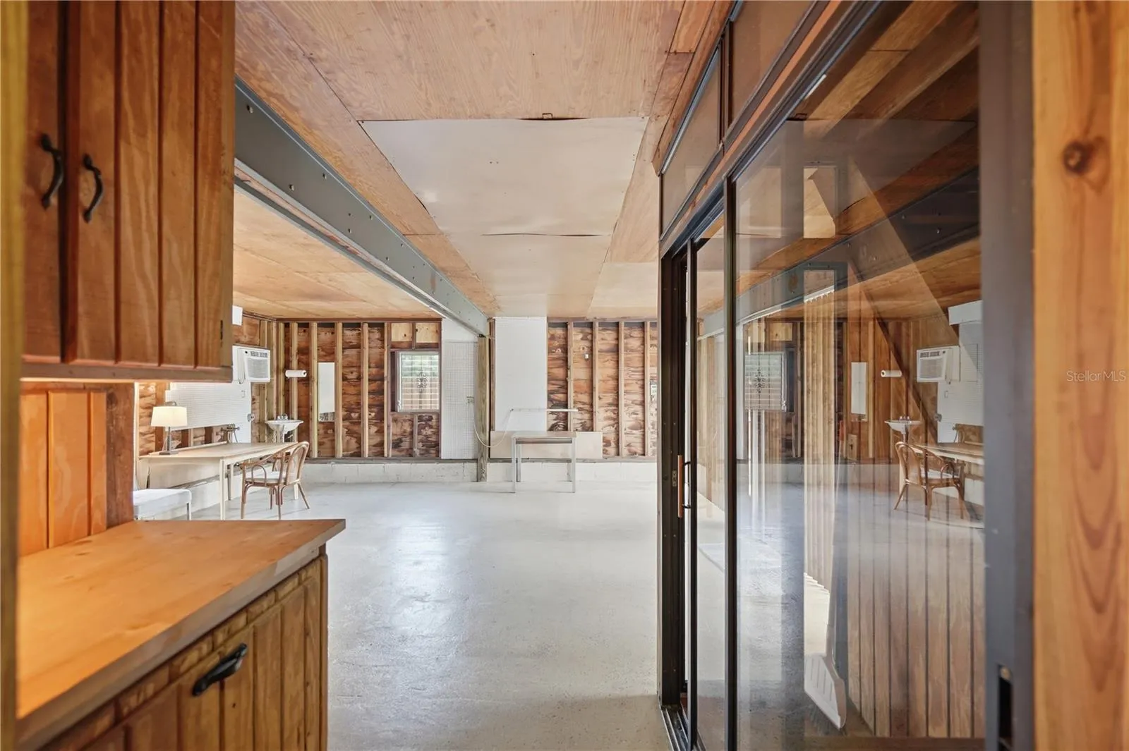 LARGE AREA THAT CAN BE CONVERTED TO ANYTHING YOU WOULD LIKE-ART STUDIO, EXERCISE ROOM, ETC.  GLASS ARE TO RIGHT IS THE CLOSED UP STAIRCASE THAT CAN BE REOPENED