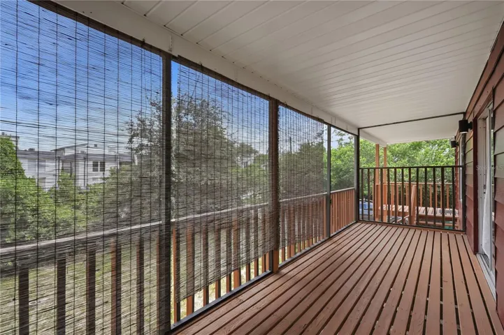 SCREENED IN PORCH UPSTAIRS OFF LIVING AREA