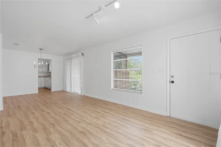 LIVING ROOM LOOKING AT DINING AREA AND KITCHEN