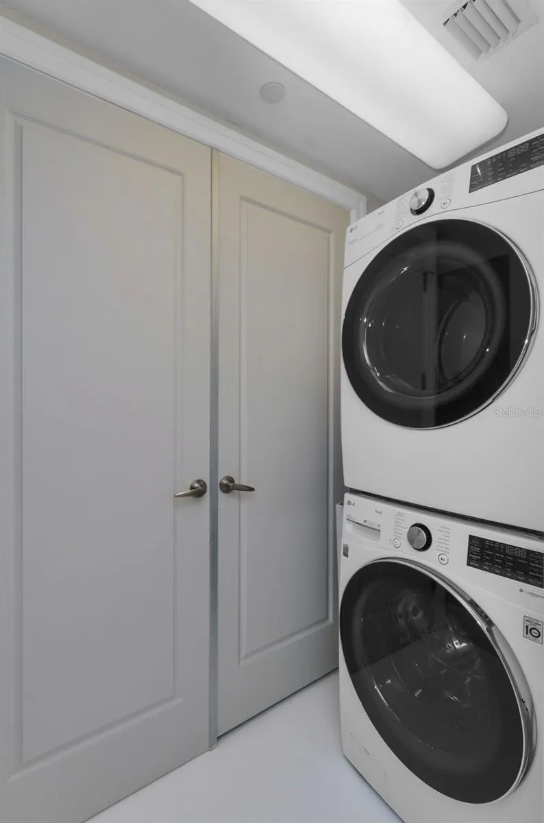 additional area with washer dryer and doors to ac handler
