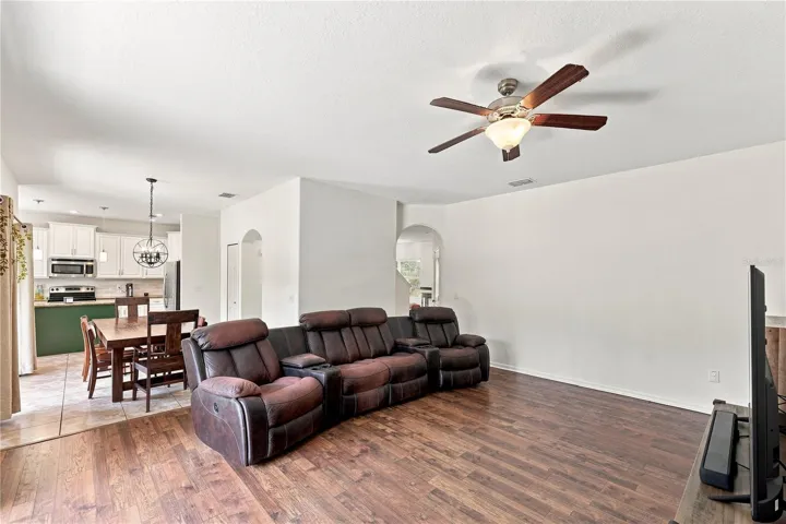 Living room large enough to hold multiple sofa pieces
